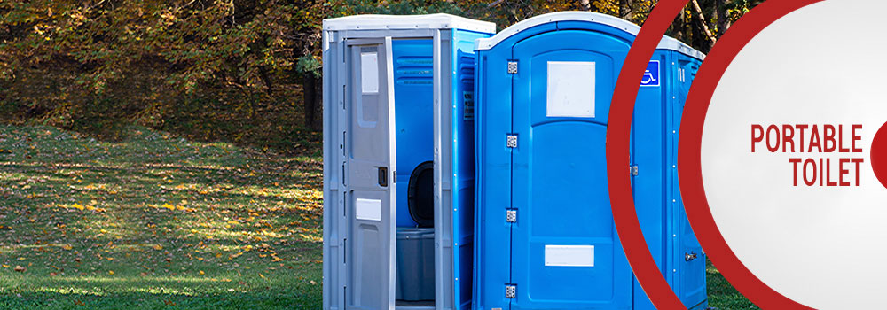 two portable toilets in a park
